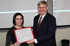 Paula Castillo is receiving from Dr. Ragsdale, Dept. Head, the “Outstanding Master of Science Entomology student award“